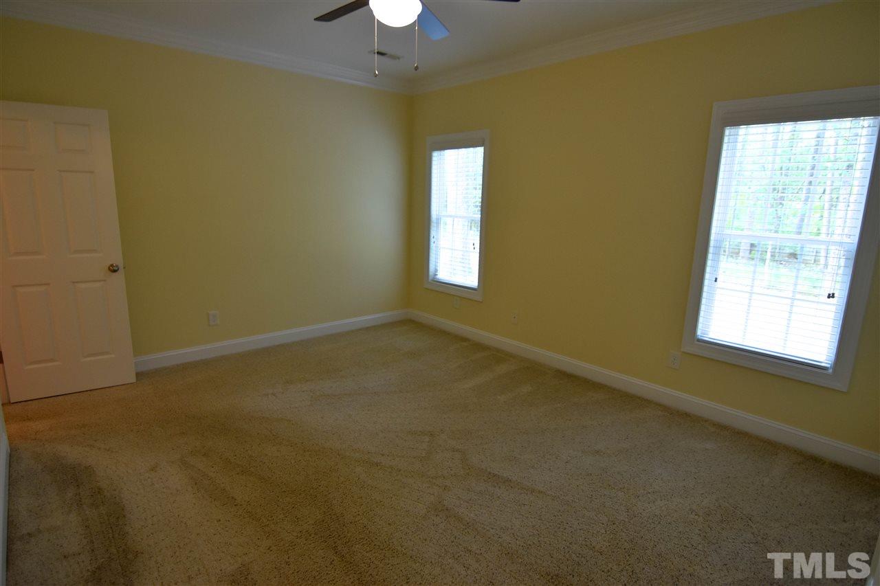 292 Ned Moore Road Timberlake, NC 27583 - Photo 13 of 25 a view of an empty room with a window