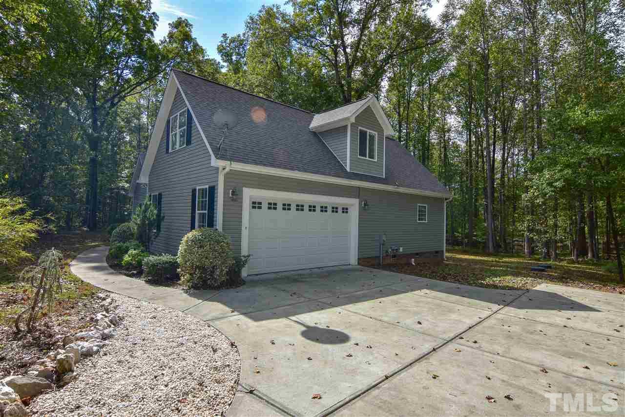 292 Ned Moore Road Timberlake, NC 27583 - Photo 23 of 25 a view of a house with a yard