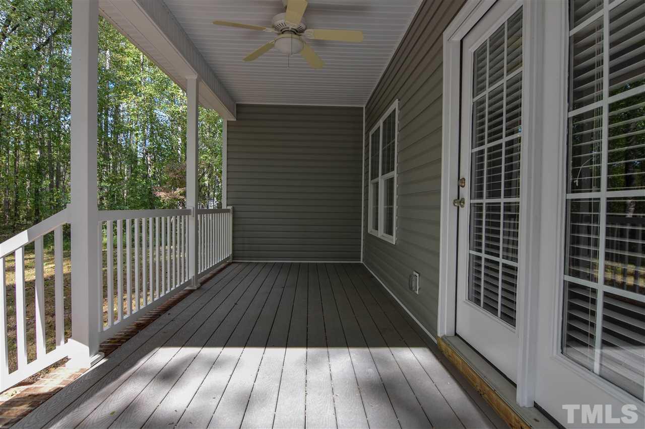 292 Ned Moore Road Timberlake, NC 27583 - Photo 25 of 25 a view of a balcony with wooden floor