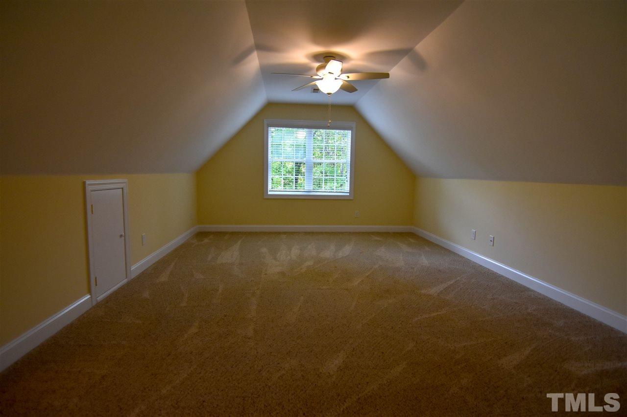 292 Ned Moore Road Timberlake, NC 27583 - Photo 5 of 25 an empty room with a window