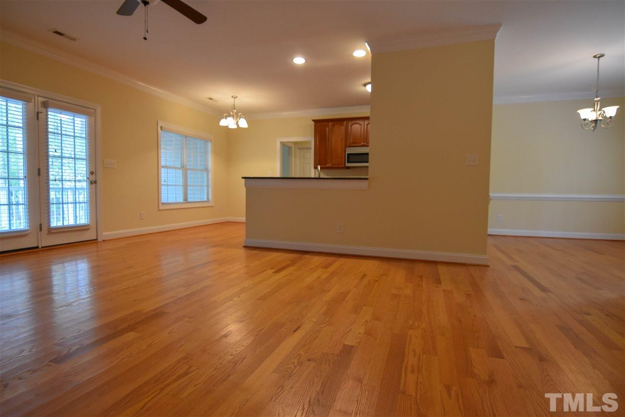 292 Ned Moore Road Timberlake, NC 27583 - Photo 7 of 25 an empty room with wooden floor and windows