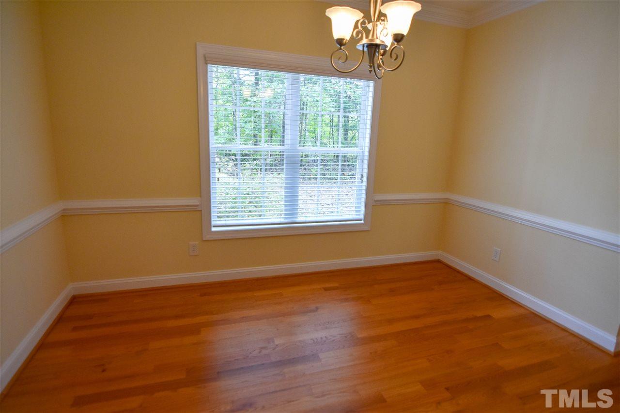 292 Ned Moore Road Timberlake, NC 27583 - Photo 10 of 25 a view of an empty room with wooden floor and a window