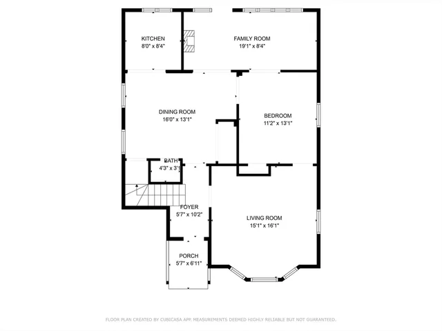 a picture of a bench in front of a wall