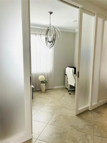 a view of a livingroom with furniture and a flat screen tv