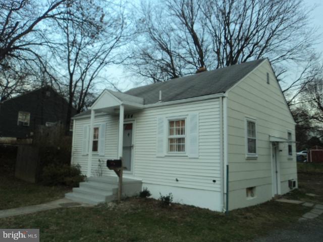 4304 Randolph Road Silver Spring, MD 20906 - Photo 11 of 14 a view of a small white house with a large tree