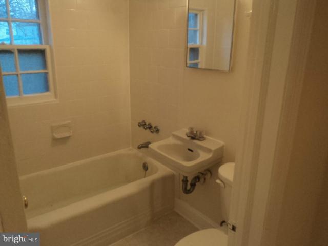 4304 Randolph Road Silver Spring, MD 20906 - Photo 13 of 14 a bathroom with a sink and mirror