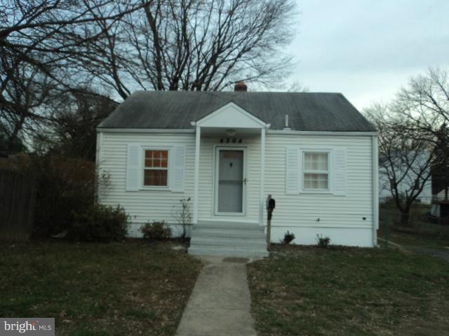 4304 Randolph Road Silver Spring, MD 20906 - Photo 14 of 14 a front view of a house with a yard