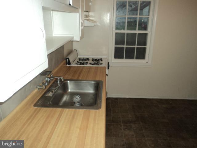 4304 Randolph Road Silver Spring, MD 20906 - Photo 4 of 14 a bathroom with a sink and a window