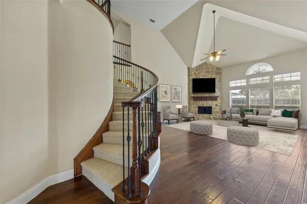 a view of entryway livingroom and hall with wooden floor