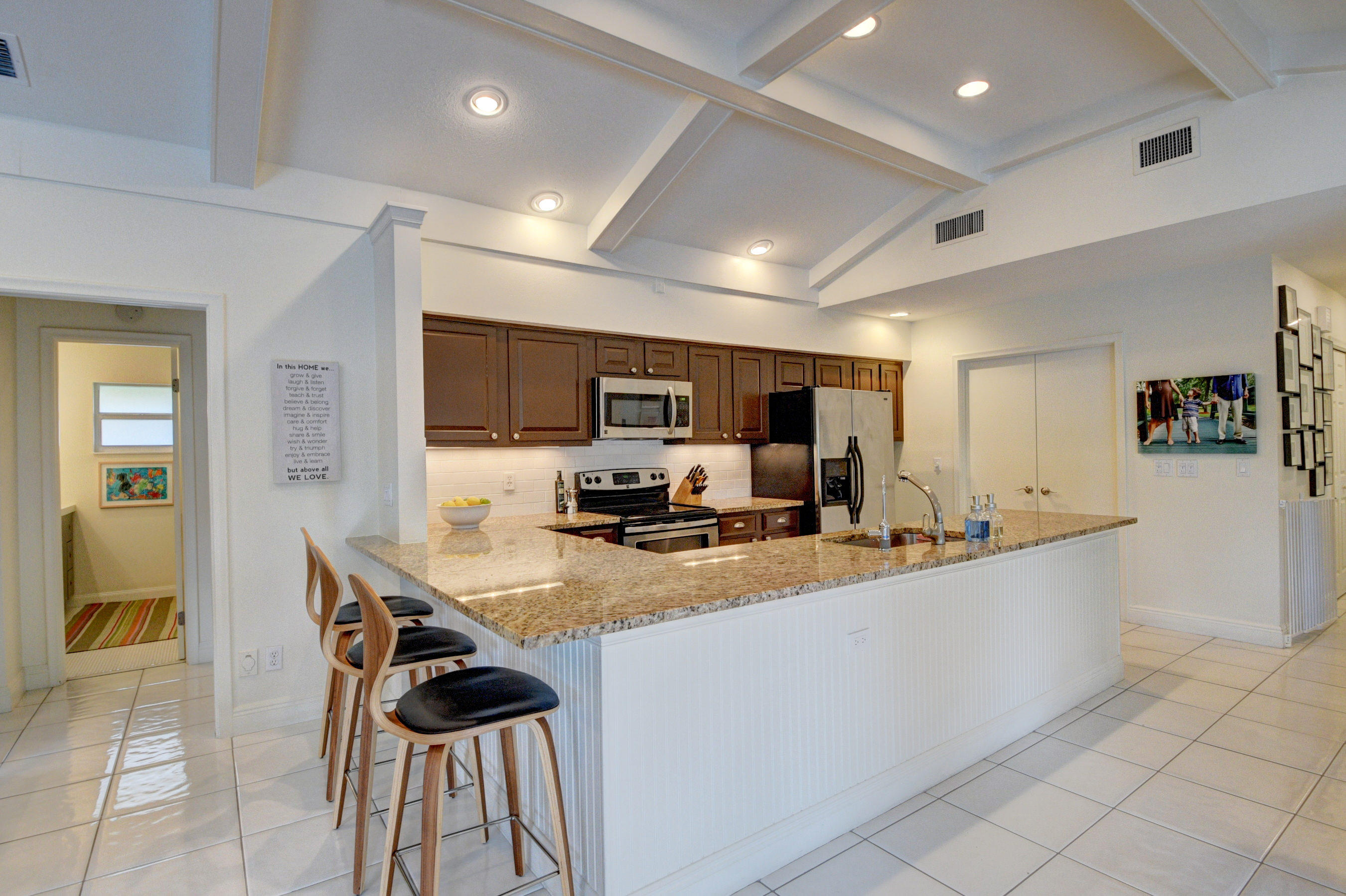 7624 Marbella Terrace Boca Raton, FL 33433 - Photo 16 of 55 a kitchen with sink cabinets and refrigerator