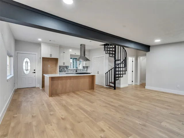 a view of a kitchen with a sink