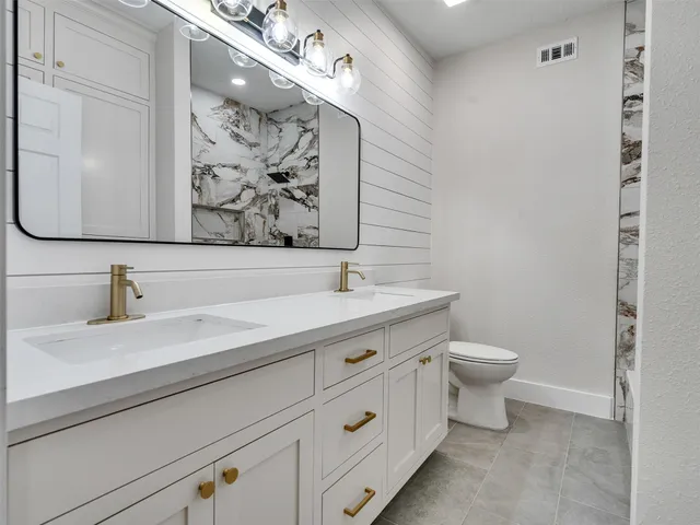 a bathroom with a sink and a toilet