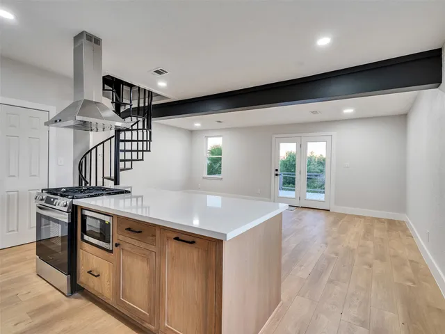 a kitchen with a stove and a sink