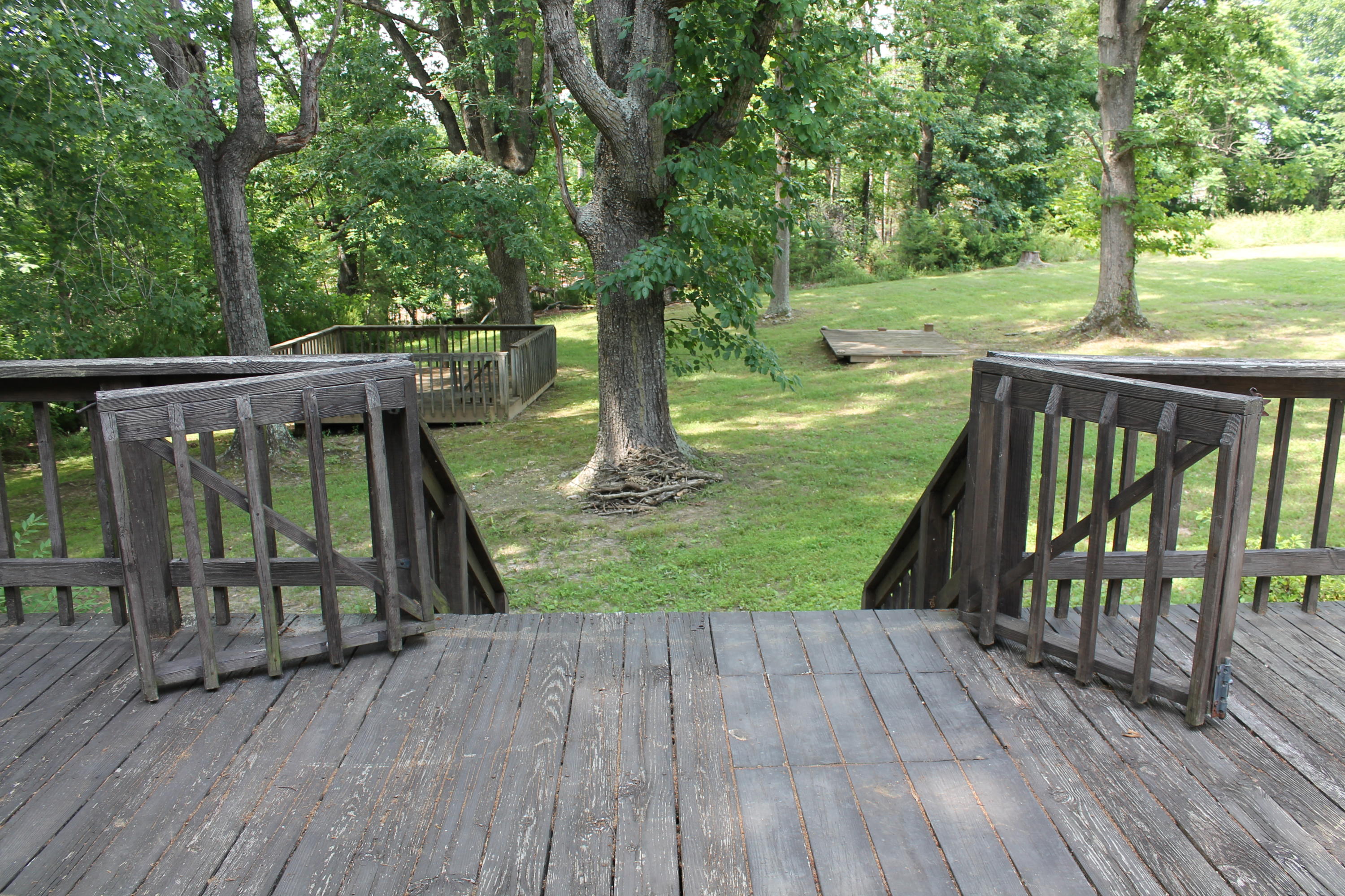 13753 West Gretna Road Sandy Level, VA 24161 - Photo 30 of 99 a view of deck with a large trees and wooden fence