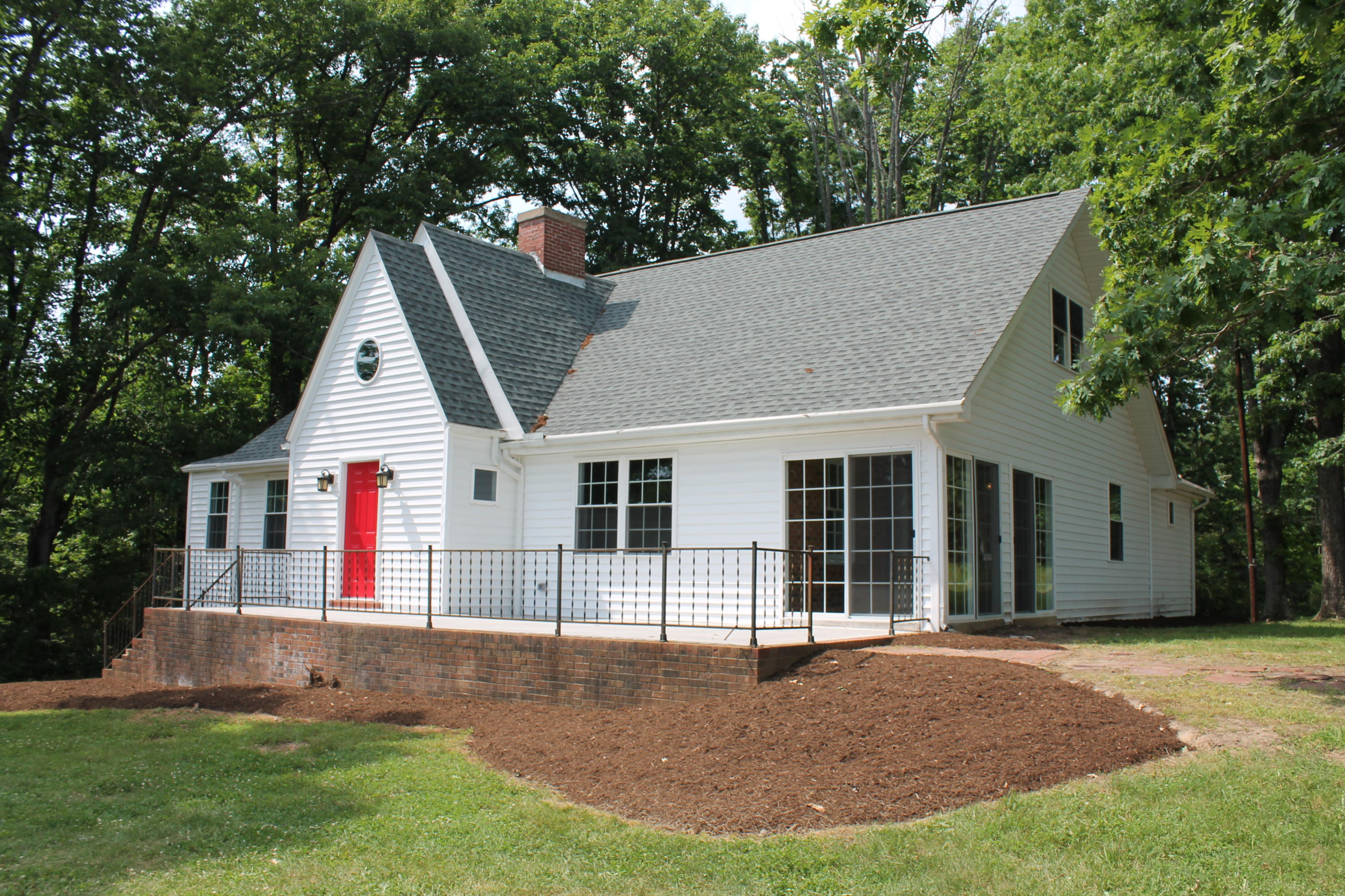13753 West Gretna Road Sandy Level, VA 24161 - Photo 33 of 99 a view of a house with a yard potted plants and a large tree