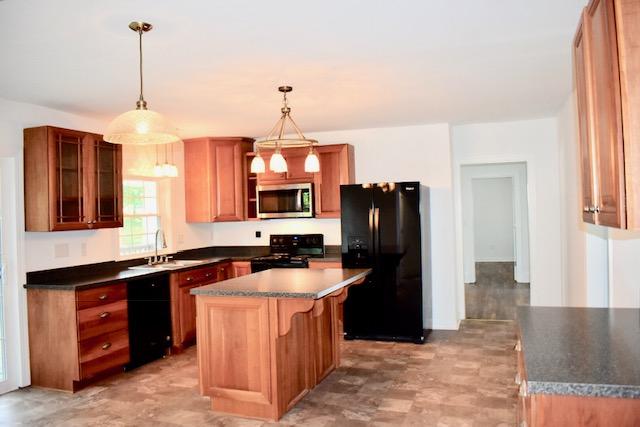 13753 West Gretna Road Sandy Level, VA 24161 - Photo 40 of 99 a kitchen with stainless steel appliances granite countertop a refrigerator a sink a stove and island