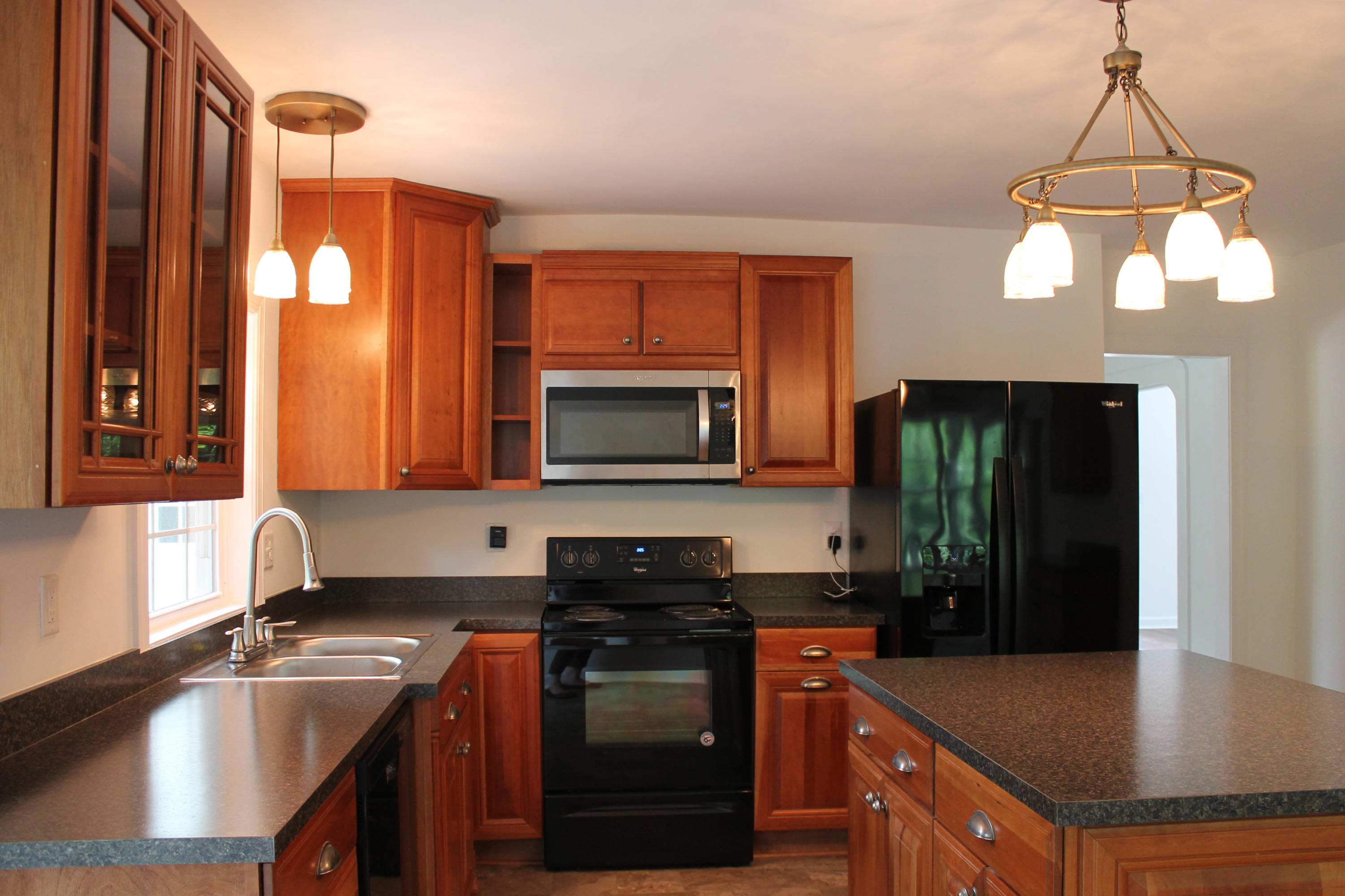 13753 West Gretna Road Sandy Level, VA 24161 - Photo 41 of 99 a kitchen with stainless steel appliances granite countertop a sink a stove and a refrigerator