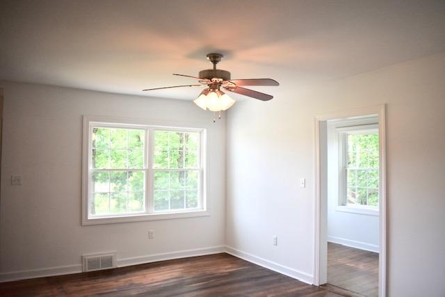13753 West Gretna Road Sandy Level, VA 24161 - Photo 54 of 99 a view of an empty room with wooden floor and a window