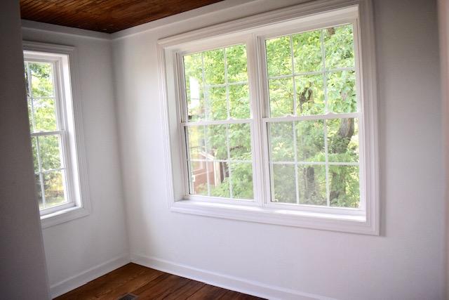 13753 West Gretna Road Sandy Level, VA 24161 - Photo 56 of 99 a view of an empty room with wooden floor and a window