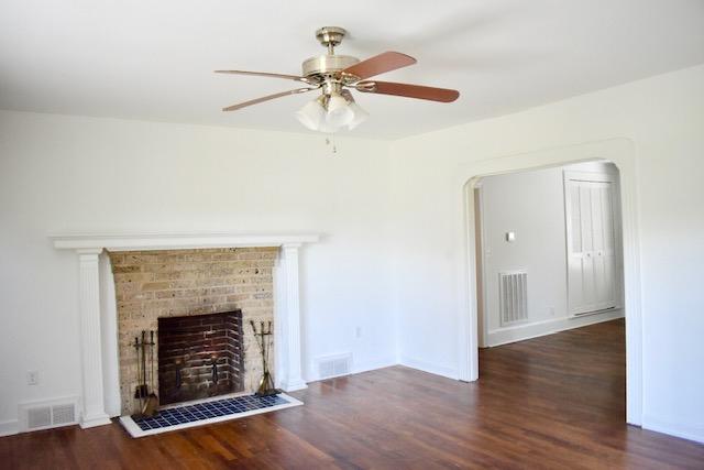 13753 West Gretna Road Sandy Level, VA 24161 - Photo 66 of 99 a view of an empty room with wooden floor fireplace and a window