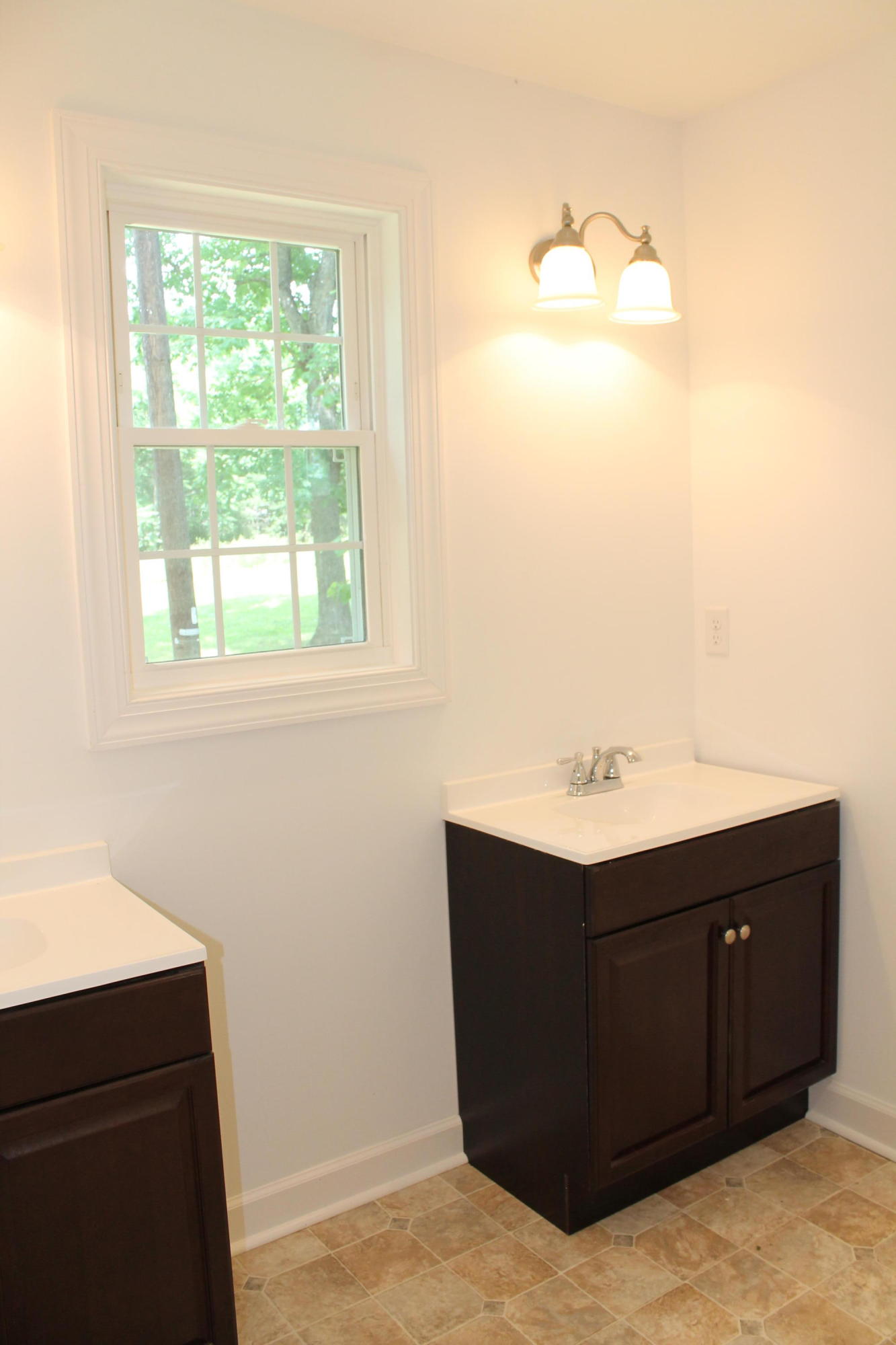 13753 West Gretna Road Sandy Level, VA 24161 - Photo 74 of 99 a room with a cabinet and mirror