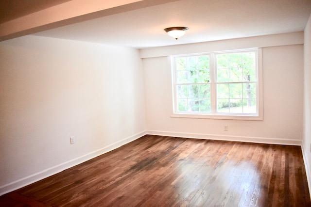 13753 West Gretna Road Sandy Level, VA 24161 - Photo 77 of 99 a view of an empty room with wooden floor and a window