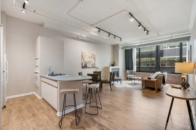a kitchen with granite countertop a stove and a table
