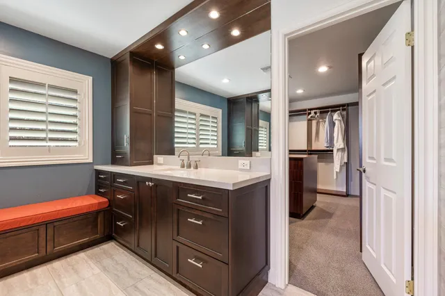 a kitchen with a refrigerator and a sink