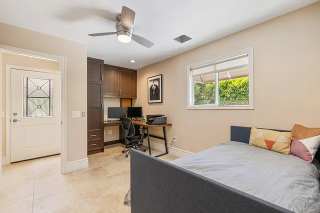 a bedroom with a bed and a table