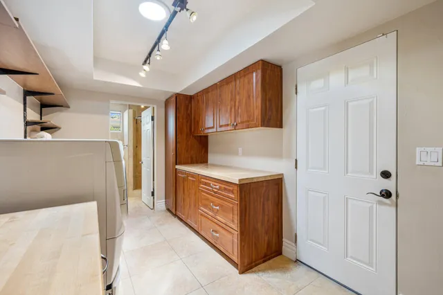a kitchen with stainless steel appliances granite countertop a refrigerator and a stove