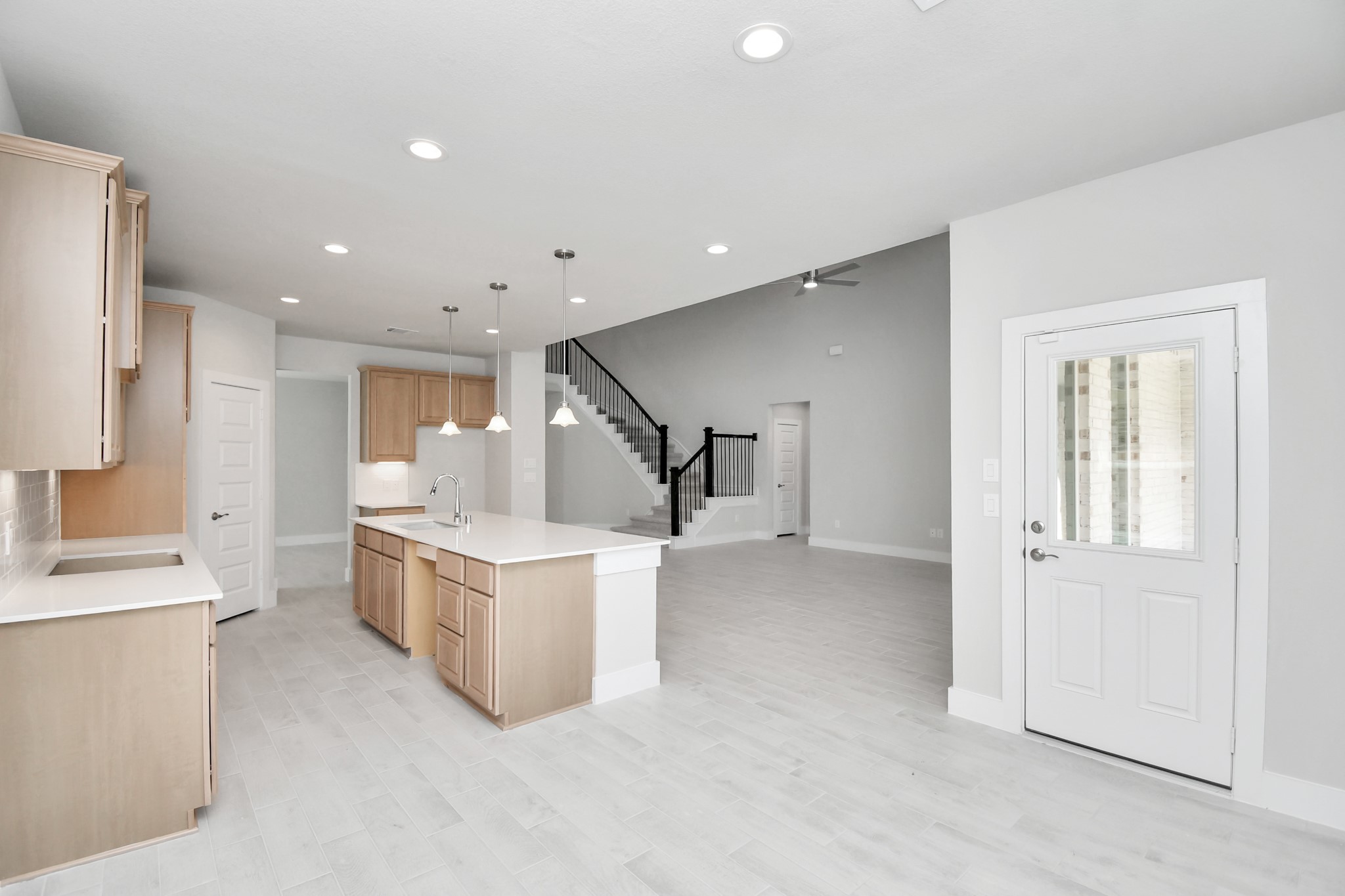 3106 Skerne Spring Dr Spring Spring, TX 77373 - Photo 17 of 47 Enjoy breakfast with ease in the connected and cozy breakfast area, seamlessly integrated with the kitchen for utmost convenience. Step through the back door for a breath of fresh air onto the covered patio, extending your living space to the outdoors