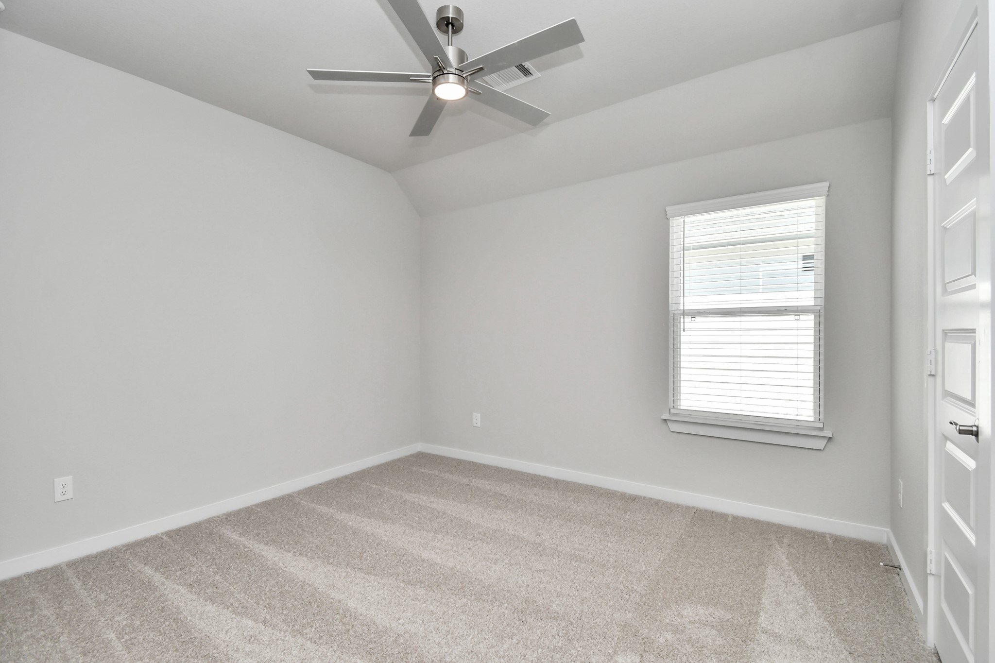 3106 Skerne Spring Dr Spring Spring, TX 77373 - Photo 41 of 47 Secondary bedroom features plush carpeting, large windows that let in plenty of natural light, bright paint, and spacious closets.