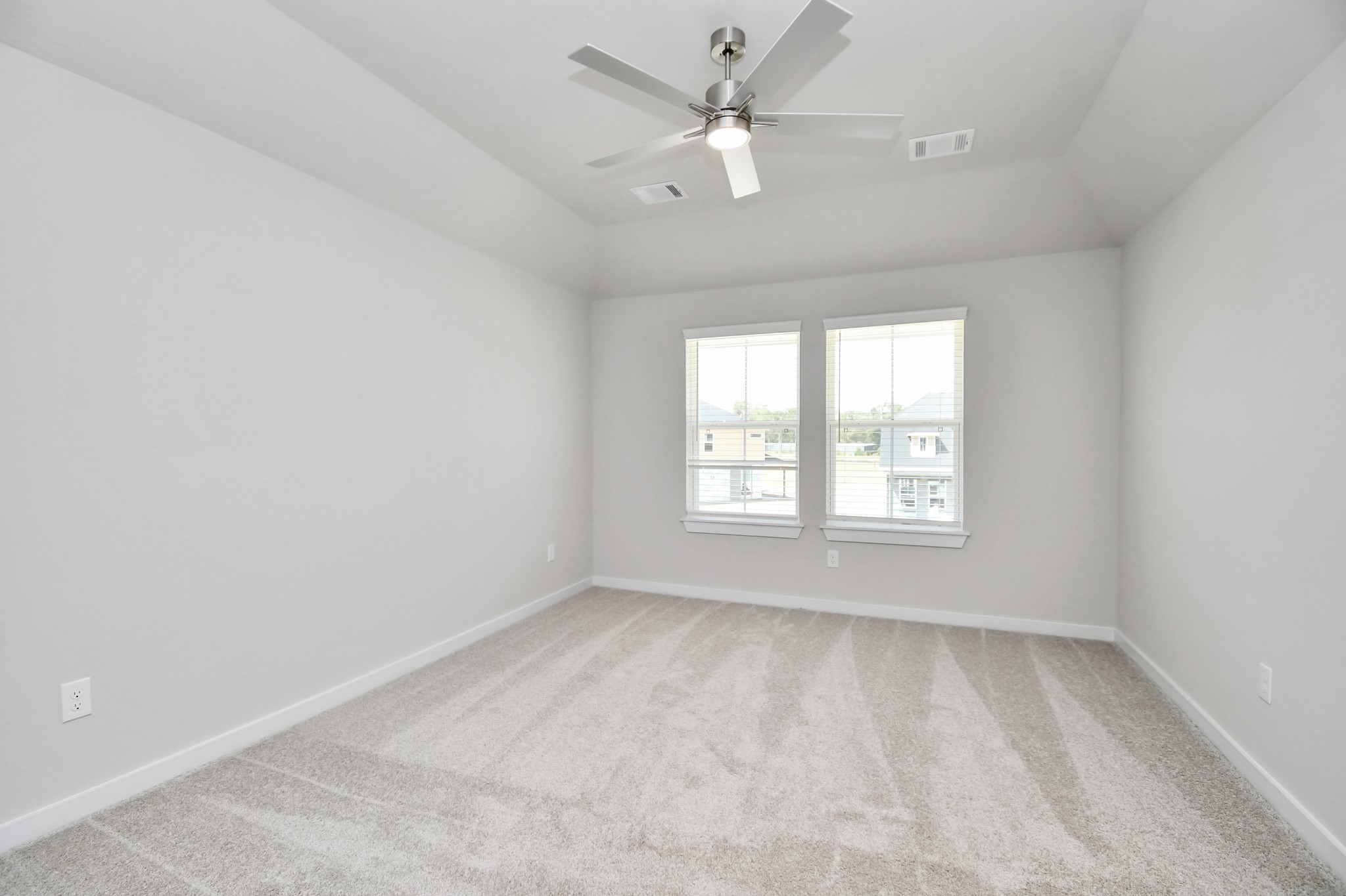 3106 Skerne Spring Dr Spring Spring, TX 77373 - Photo 42 of 47 Secondary bedroom features plush carpeting, large windows that let in plenty of natural light, bright paint, and spacious closets.