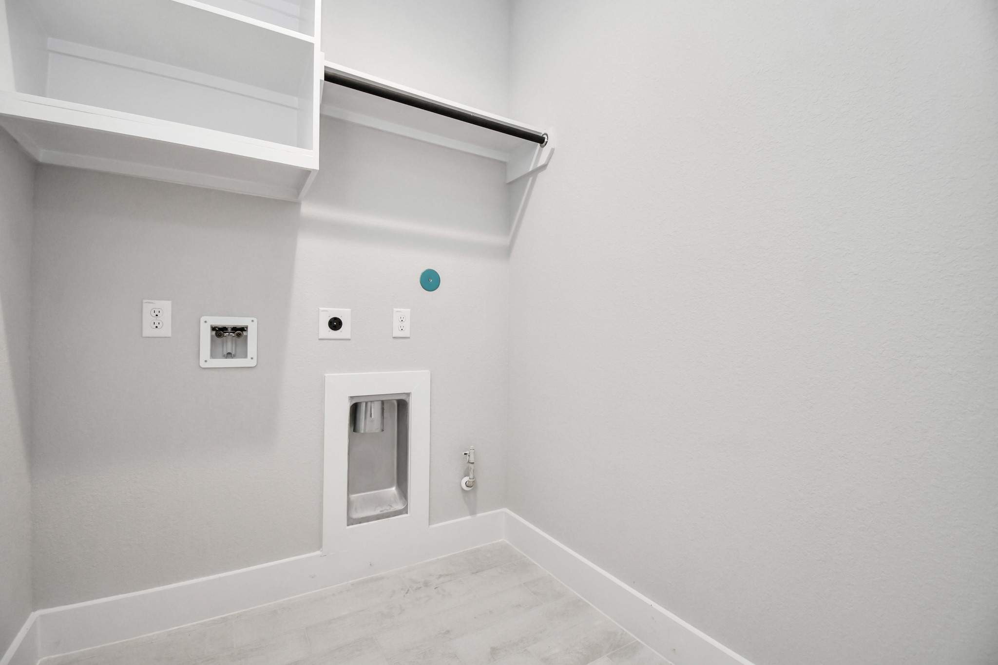 3106 Skerne Spring Dr Spring Spring, TX 77373 - Photo 43 of 47 A perfect blend of functionality and comfort. Capture the essence of easy living with a first-floor laundry room, thoughtfully equipped with shelving for effortless organization. Both electric and gas connections available.