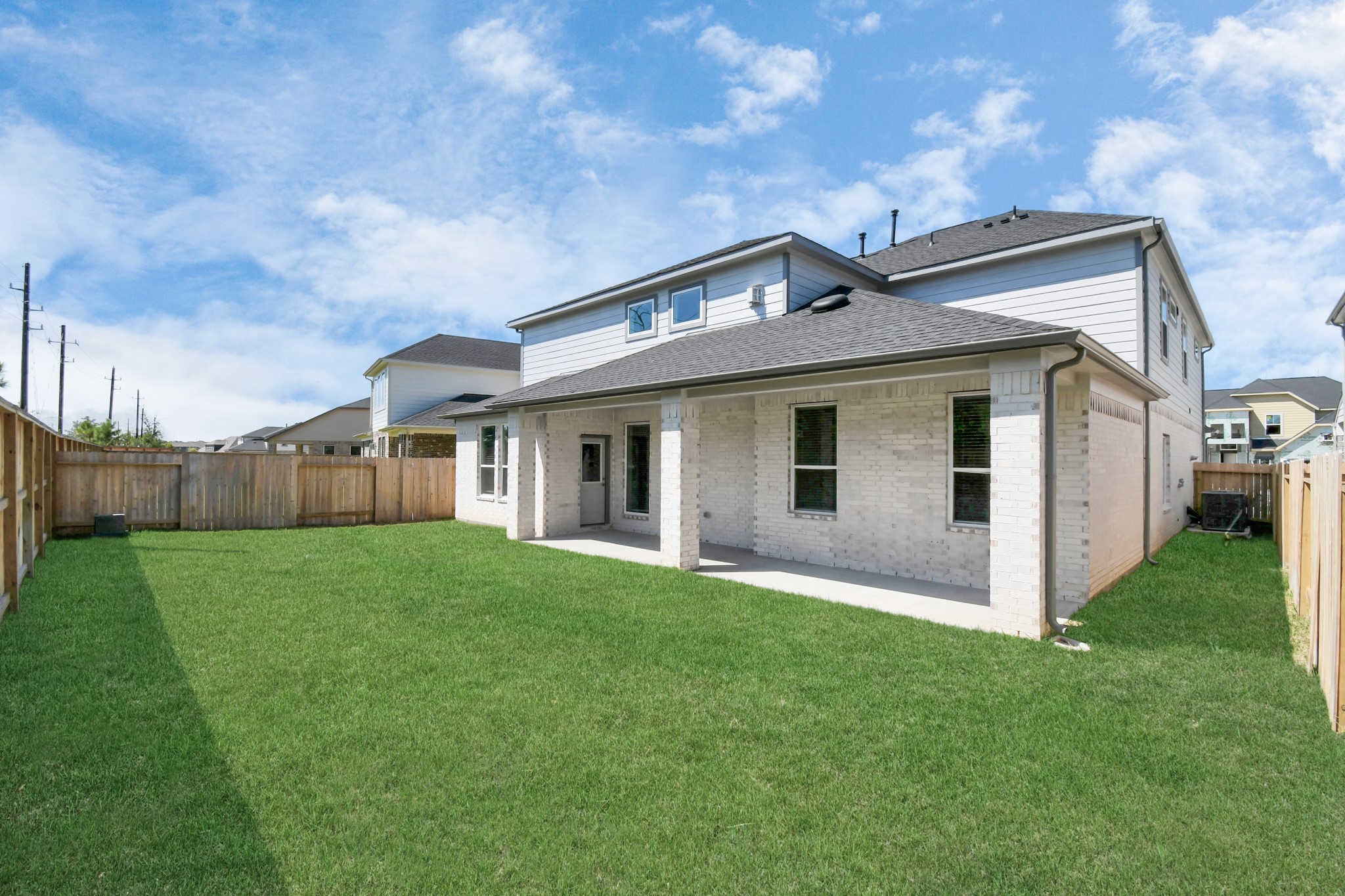 3106 Skerne Spring Dr Spring Spring, TX 77373 - Photo 45 of 47 Explore the expansive backyard with its inviting covered patio—a perfect blend of space for the kids to play and adults to unwind. Ideal for creating your outdoor oasis, this backyard accommodates patio furniture, a BBQ pit, and endless possibilities for leisure and entertainment.