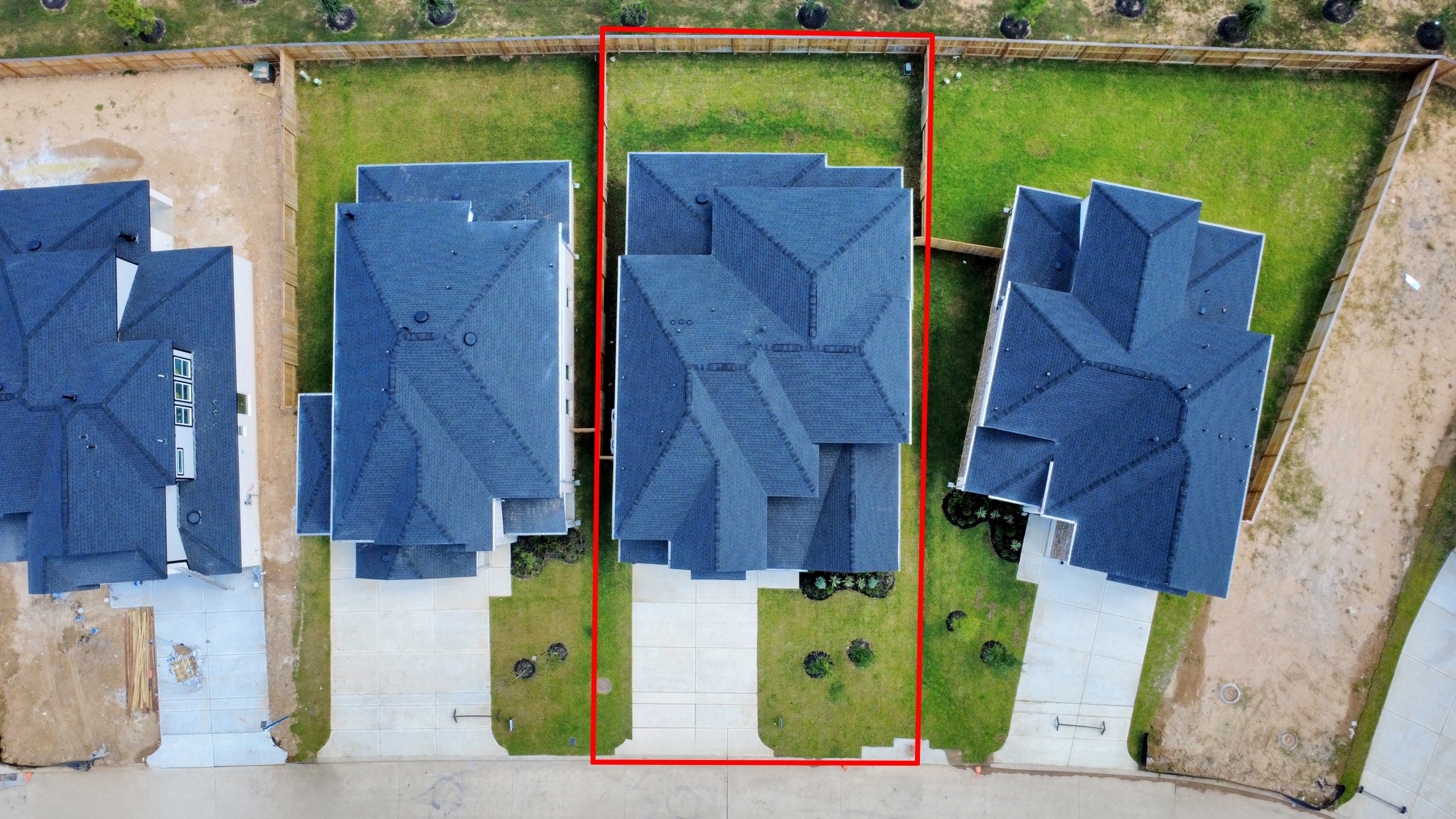 3106 Skerne Spring Dr Spring Spring, TX 77373 - Photo 5 of 47 An aerial view of a spacious subdivision lot, highlighting a well-maintained yard and a fully fenced perimeter, offering both privacy and expansive outdoor space.