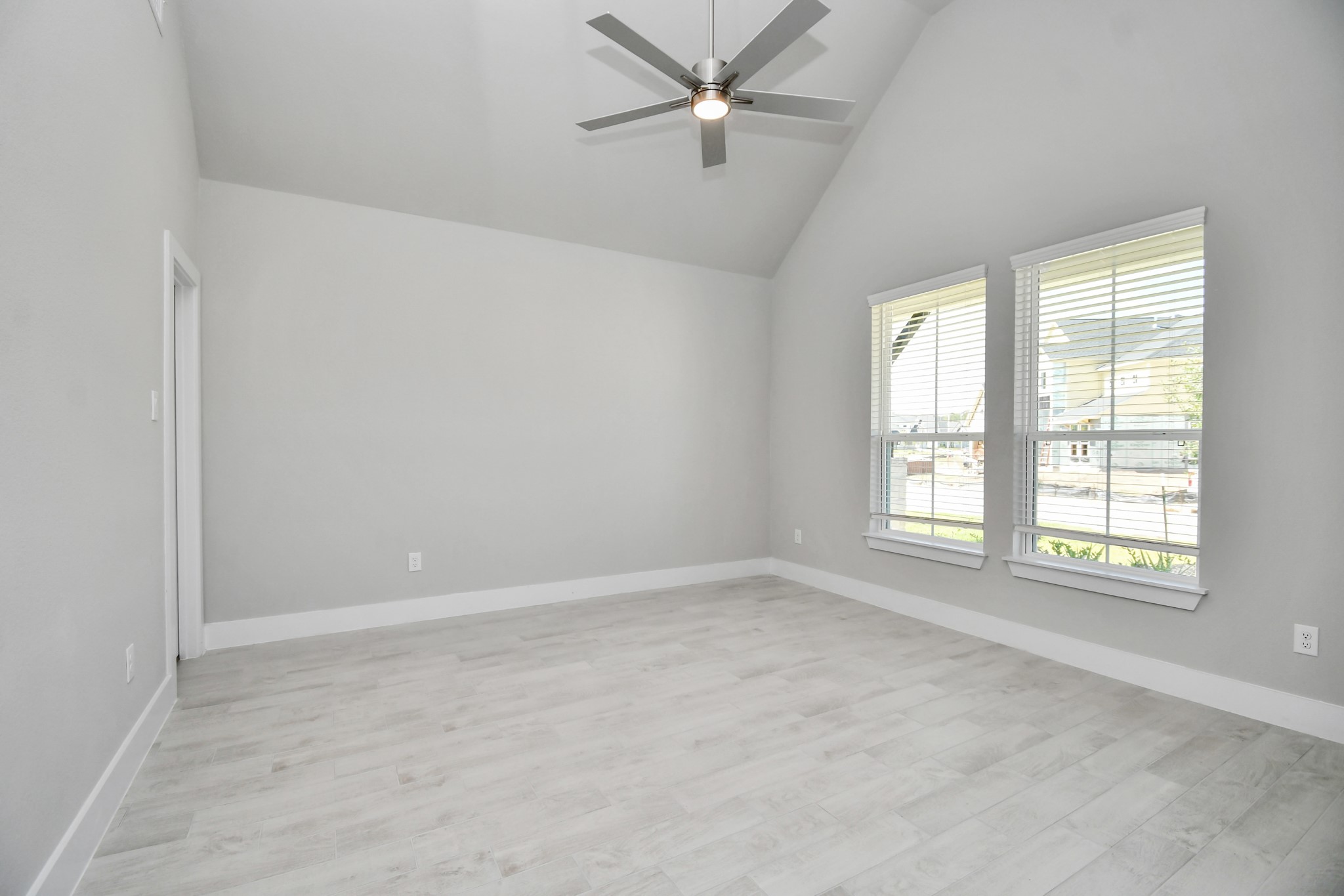 3106 Skerne Spring Dr Spring Spring, TX 77373 - Photo 7 of 47 Step into the inviting home office, where elegant tile flooring adds a touch of freshness and comfort to the workspace. Natural light pours through the window, creating an inspiring environment for productivity and focus.