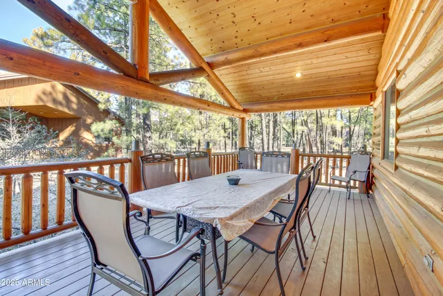 a view of a chairs and table in the balcony