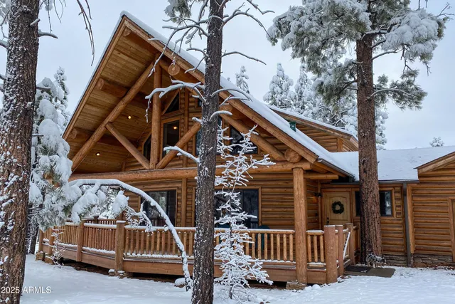 a view of front door of a house with a deck