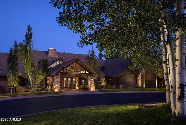 a view of house with outdoor space and swimming pool