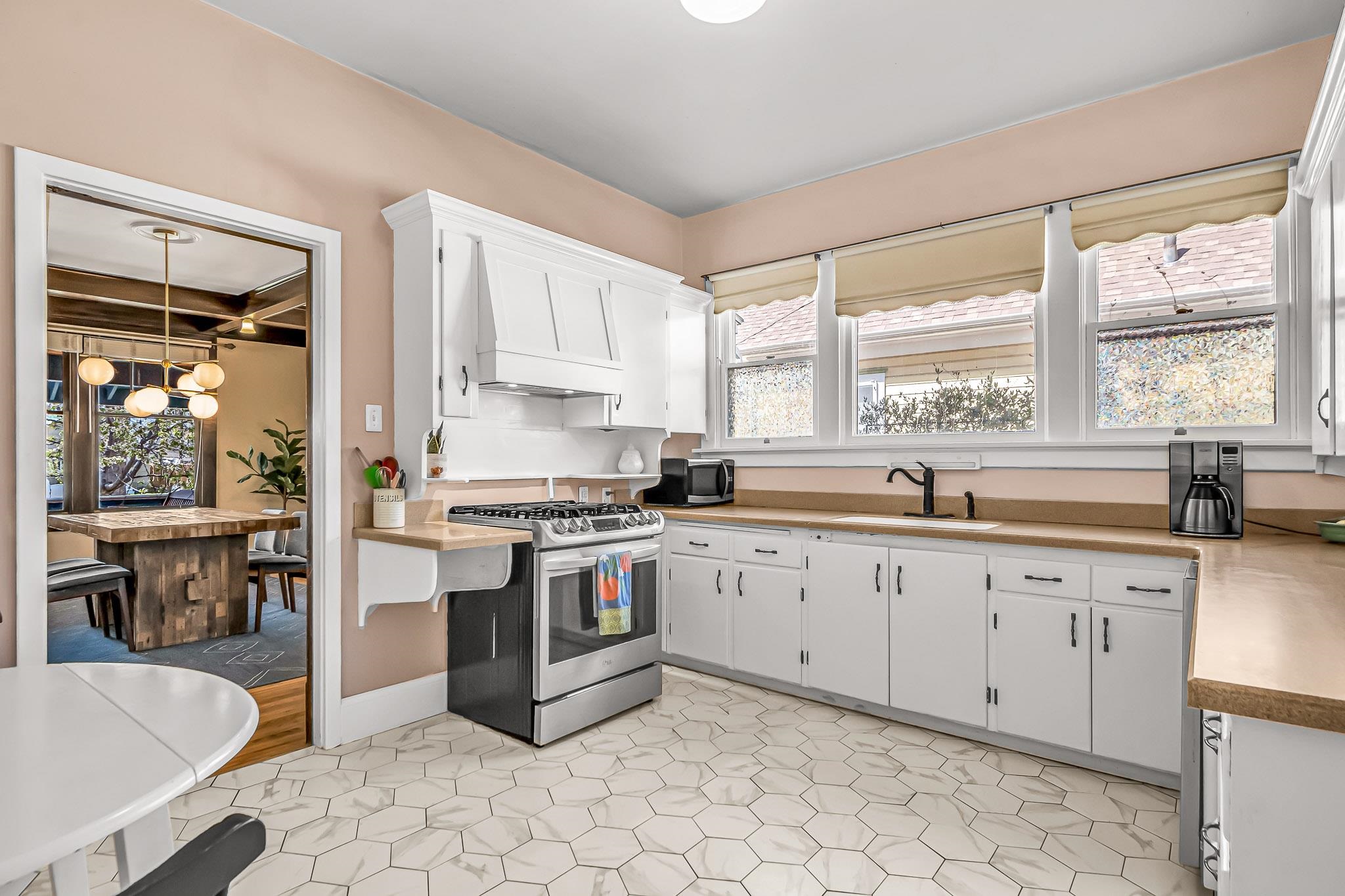 1244 Main Street Grand Junction, CO 81501 - Photo 15 of 33 a kitchen with stainless steel appliances granite countertop a stove a sink and a refrigerator
