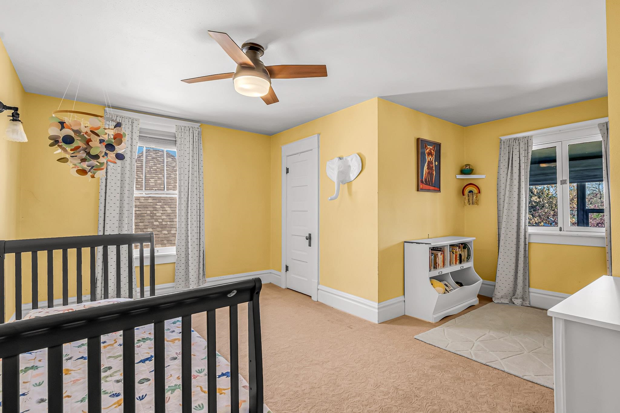 1244 Main Street Grand Junction, CO 81501 - Photo 24 of 33 a view of a livingroom with wooden floor and a ceiling fan