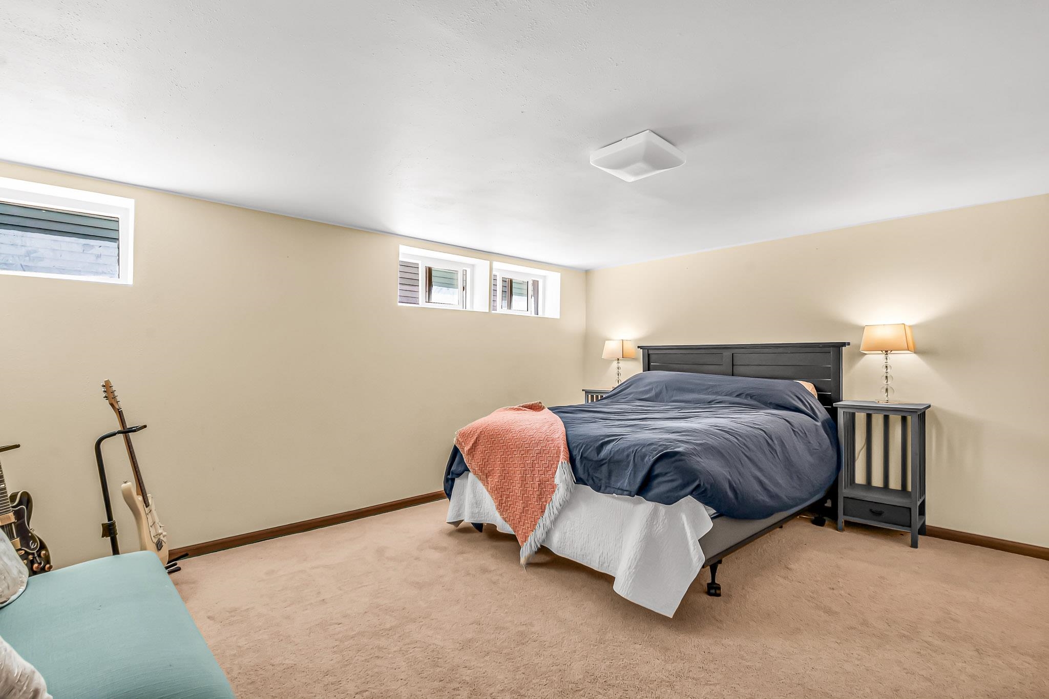 1244 Main Street Grand Junction, CO 81501 - Photo 27 of 33 a bedroom with a bed and a couch