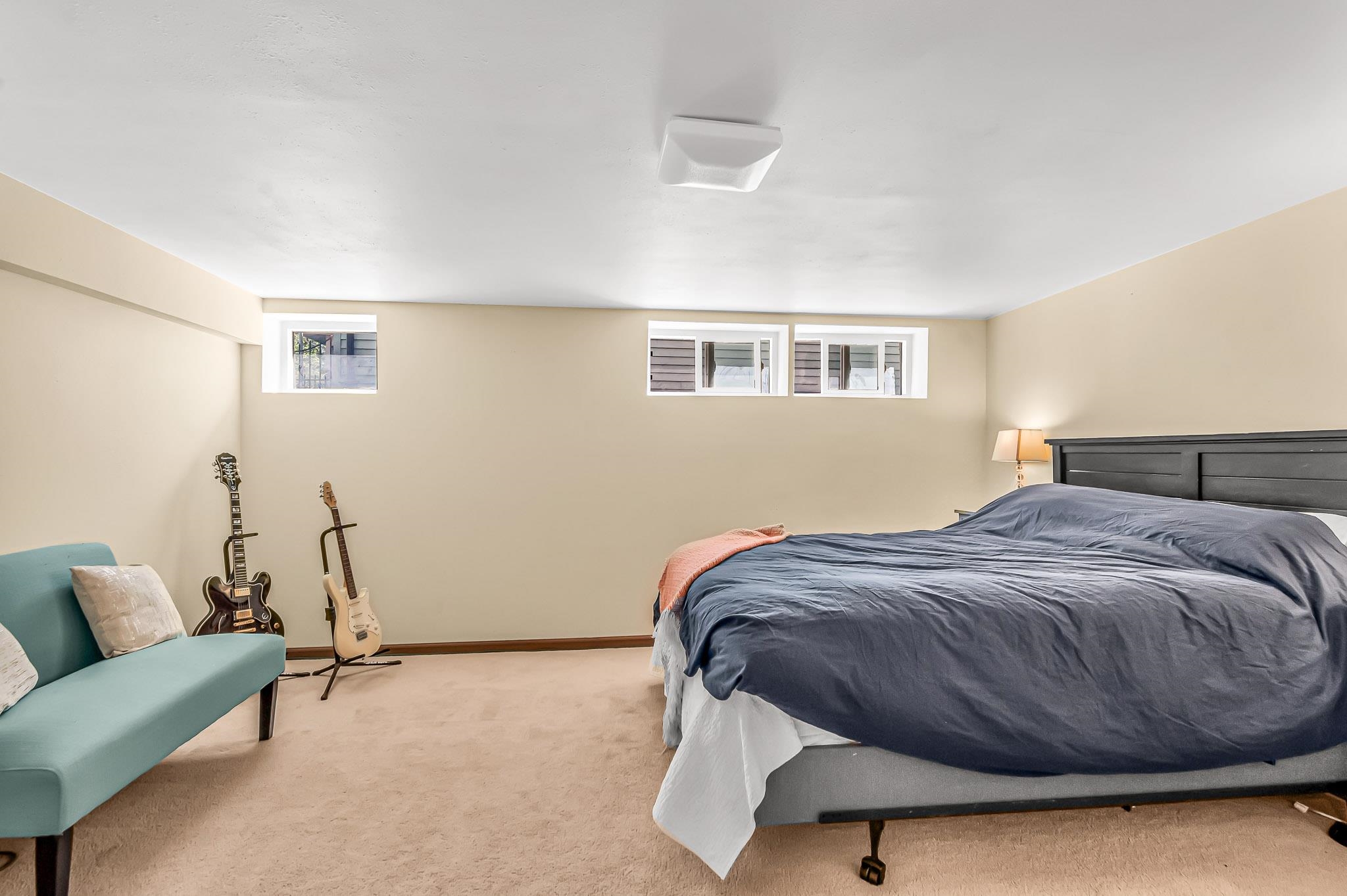 1244 Main Street Grand Junction, CO 81501 - Photo 28 of 33 a bedroom with a bed and a couch