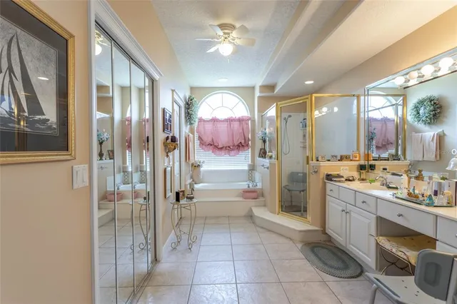 a bathroom with a double vanity sink toilet and shower