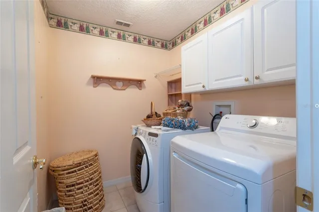 a view of bathroom with washer and dryer