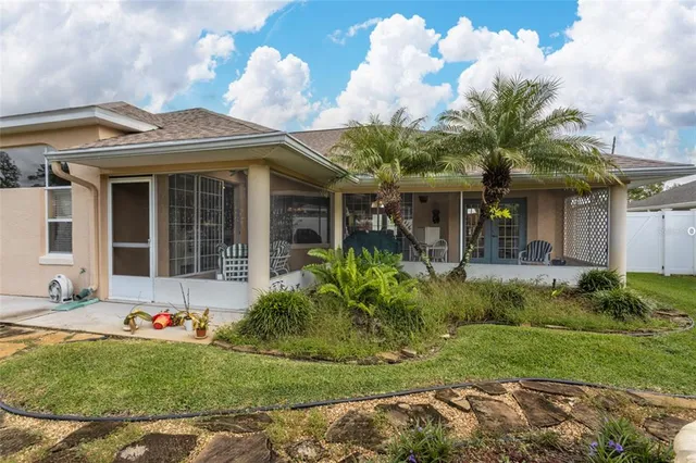 a view of a house with a yard and plants