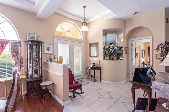 a view of a livingroom with furniture window and wooden floor