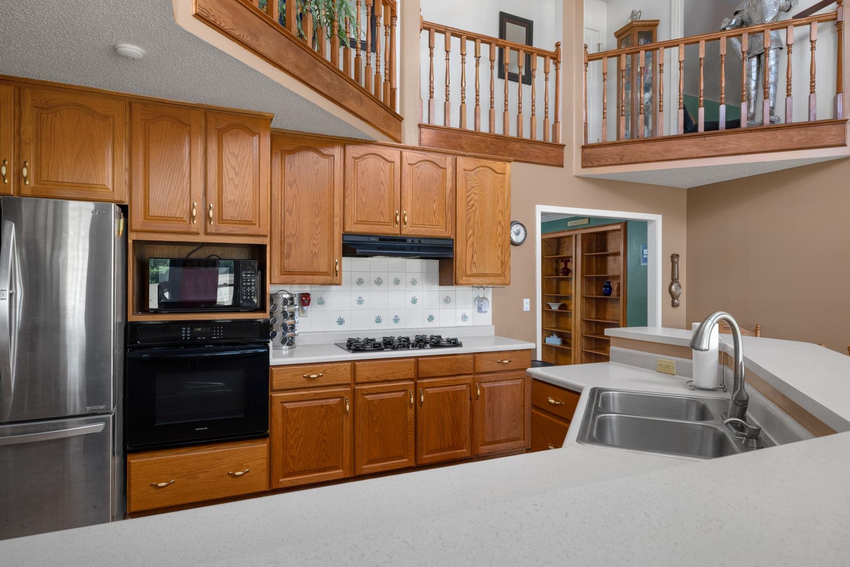 8539 Campground Road Drummonds, TN 38023 - Photo 14 of 38 a kitchen that has a sink and a refrigerator