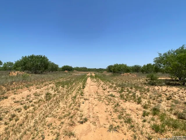 a view of lake with green space